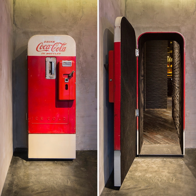 speakeasy hidden bar hidden behind a coca cola fridge